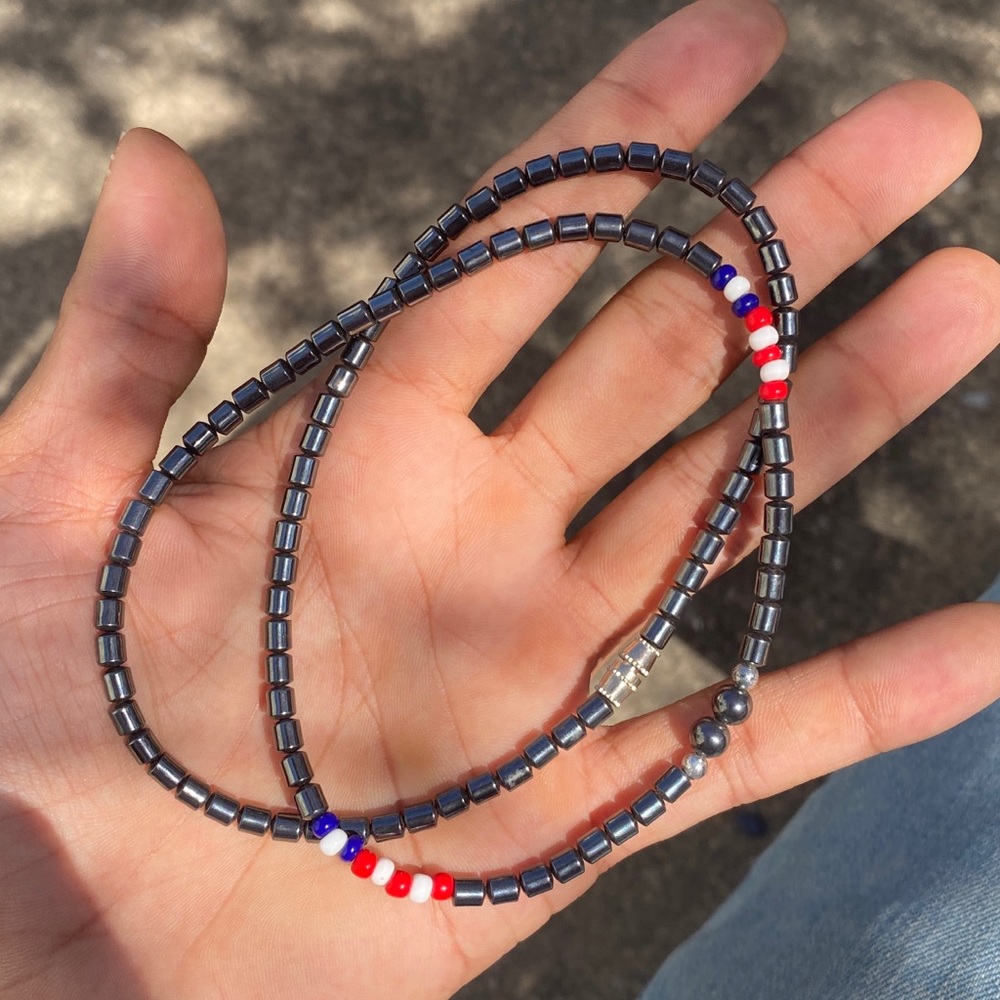 Hand made hematite necklace with red white and blue beads and screw clasp